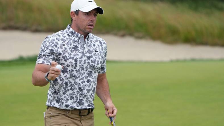 Jun 16, 2022; Brookline, Massachusetts, USA; Rory McIlroy acknowledges the crowd after a putt on the fifth green during the first round of the U.S. Open golf tournament. Mandatory Credit: John David Mercer-USA TODAY Sports