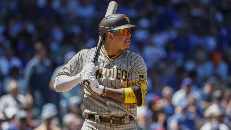 Jun 16, 2022; Chicago, Illinois, USA; San Diego Padres third baseman Manny Machado (13) bats against the Chicago Cubs during the second inning at Wrigley Field. Mandatory Credit: Kamil Krzaczynski-USA TODAY Sports