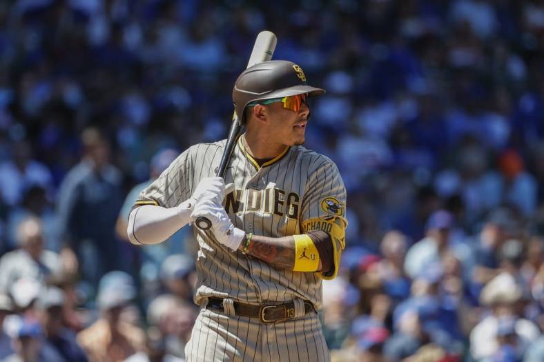 Jun 16, 2022; Chicago, Illinois, USA; San Diego Padres third baseman Manny Machado (13) bats against the Chicago Cubs during the second inning at Wrigley Field. Mandatory Credit: Kamil Krzaczynski-USA TODAY Sports