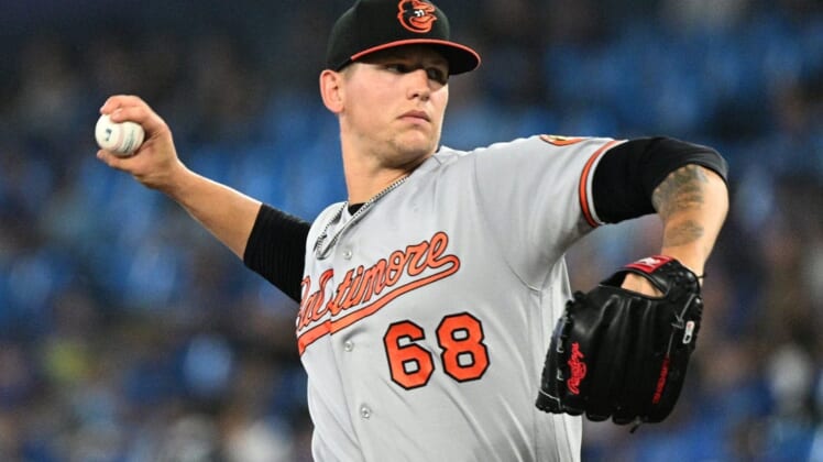 Jun 16, 2022; Toronto, Ontario, CAN; Baltimore Orioles starting pitcher Tyler Wells (68) delivers a pitch against the Toronto Blue Jays in the fourth inning at Rogers Centre. Mandatory Credit: Dan Hamilton-USA TODAY Sports