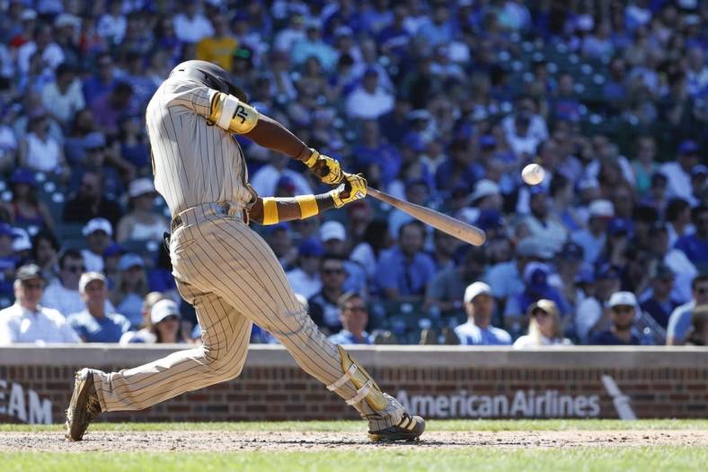 Jun 16, 2022; Chicago, Illinois, USA; San Diego Padres left fielder Jurickson Profar (10) hits a solo home run against the Chicago Cubs during the eighth inning at Wrigley Field. Mandatory Credit: Kamil Krzaczynski-USA TODAY Sports