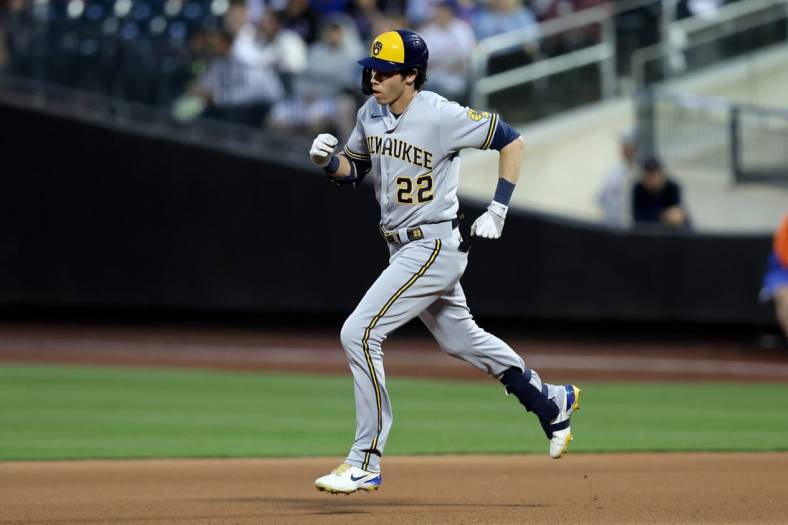 Jun 16, 2022; New York City, New York, USA; Milwaukee Brewers left fielder Christian Yelich (22) rounds the bases after hitting a solo home run against the New York Mets during the fourth inning at Citi Field. Mandatory Credit: Brad Penner-USA TODAY Sports