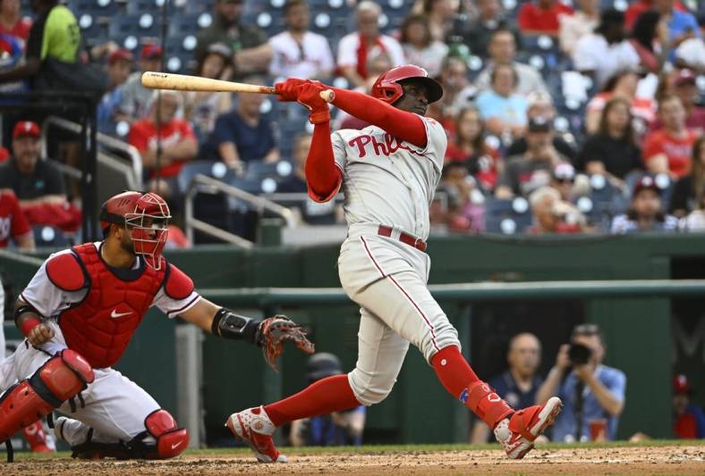 Jun 16, 2022; Washington, District of Columbia, USA; Philadelphia Phillies shortstop Didi Gregorius (18) hits a two RBI double against the Washington Nationals during the third inning at Nationals Park. Mandatory Credit: Brad Mills-USA TODAY Sports