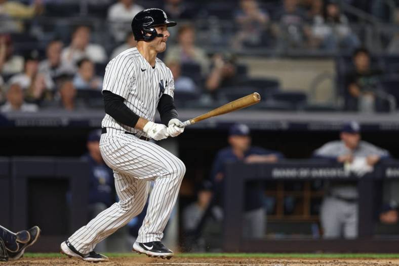 Jun 16, 2022; Bronx, New York, USA; New York Yankees first baseman Anthony Rizzo (48) hits an RBI single during the sixth inning against the Tampa Bay Rays at Yankee Stadium. Mandatory Credit: Vincent Carchietta-USA TODAY Sports