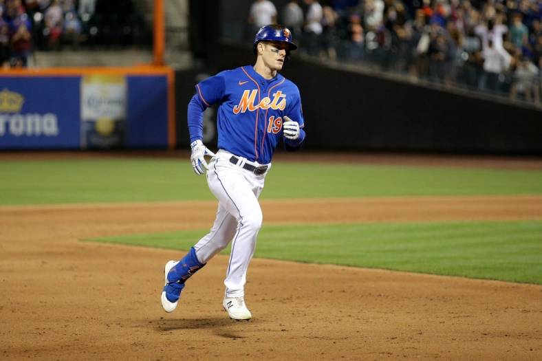 Jun 16, 2022; New York City, New York, USA; New York Mets left fielder Mark Canha (19) rounds the bases after hitting a two run home run against the Milwaukee Brewers during the fifth inning at Citi Field. Mandatory Credit: Brad Penner-USA TODAY Sports