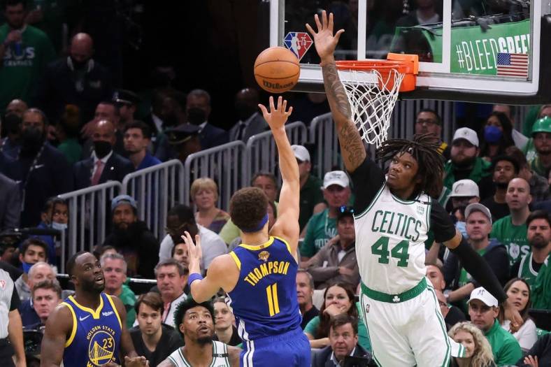 Jun 16, 2022; Boston, Massachusetts, USA; Boston Celtics center Robert Williams III (44) defends a shot from Golden State Warriors guard Klay Thompson (11) during the second quarter of game six in the 2022 NBA Finals at the TD Garden. Mandatory Credit: Paul Rutherford-USA TODAY Sports