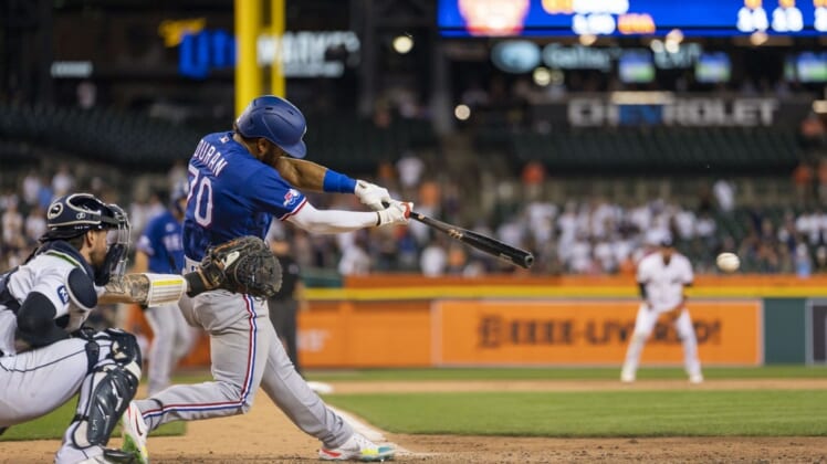 Jun 16, 2022; Detroit, Michigan, USA; Texas Rangers third baseman Ezequiel Duran (70) hits a RBI triple against Detroit Tigers starting pitcher Gregory Soto (not pictured) during the ninth inning at Comerica Park. Mandatory Credit: Raj Mehta-USA TODAY Sports