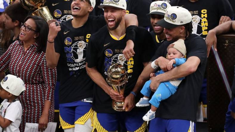 Jun 16, 2022; Boston, Massachusetts, USA; Golden State Warriors guard Jordan Poole (3), guard Stephen Curry (30), and guard Damion Lee (1) celebrate after defeating the Boston Celtics in game six of the 2022 NBA Finals at the TD Garden. Mandatory Credit: Paul Rutherford-USA TODAY Sports