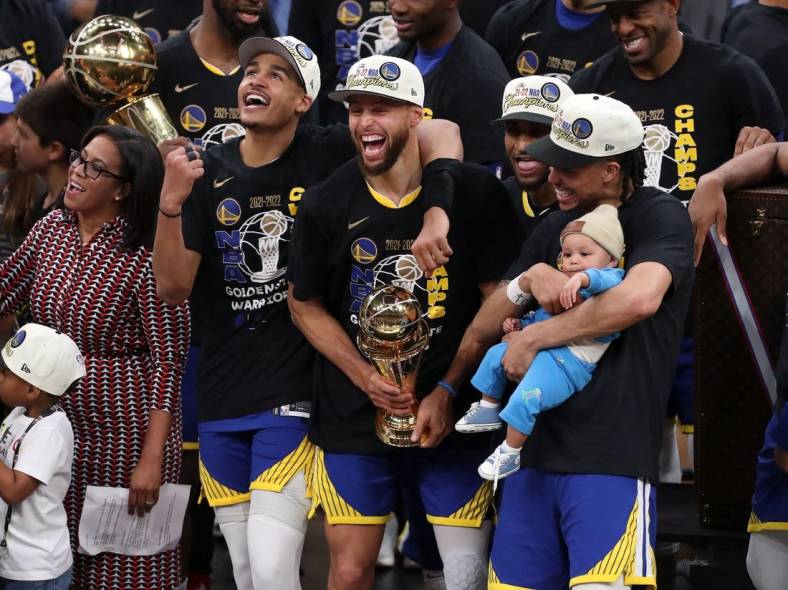 Jun 16, 2022; Boston, Massachusetts, USA; Golden State Warriors guard Jordan Poole (3), guard Stephen Curry (30), and guard Damion Lee (1) celebrate after defeating the Boston Celtics in game six of the 2022 NBA Finals at the TD Garden. Mandatory Credit: Paul Rutherford-USA TODAY Sports