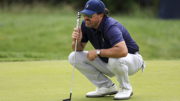 Jun 17, 2022; Brookline, Massachusetts, USA; Phil Mickelson lines up a putt on the 17th green during the second round of the U.S. Open golf tournament at The Country Club. Mandatory Credit: Aaron Doster-USA TODAY Sports
