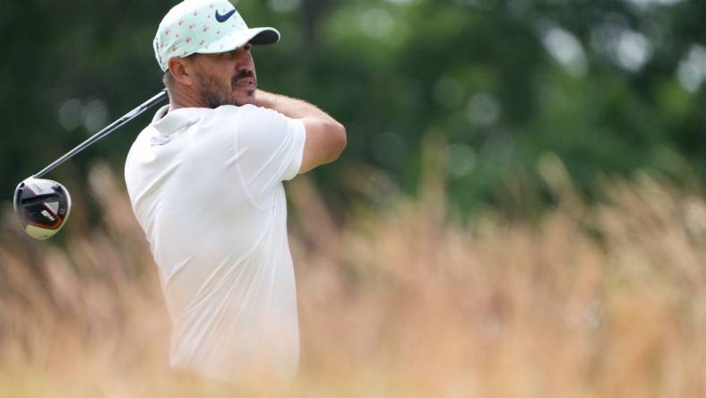 Jun 17, 2022; Brookline, Massachusetts, USA; Brooks Koepka plays his shot from the 10th tee during the second round of the U.S. Open golf tournament. Mandatory Credit: John David Mercer-USA TODAY Sports