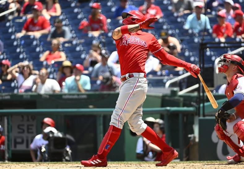 Jun 17, 2022; Washington, District of Columbia, USA; Philadelphia Phillies right fielder Nick Castellanos (8) hits a double against the Washington Nationals during the third inning at Nationals Park. Mandatory Credit: Brad Mills-USA TODAY Sports