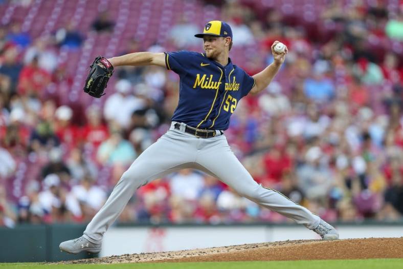 Jun 17, 2022; Cincinnati, Ohio, USA; Milwaukee Brewers starting pitcher Eric Lauer (52) pitches against the Cincinnati Reds in the first inning at Great American Ball Park. Mandatory Credit: Katie Stratman-USA TODAY Sports