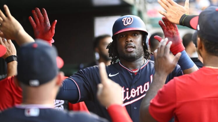 Jun 17, 2022; Washington, District of Columbia, USA; Washington Nationals first baseman Josh Bell (19) is congratulated by teammates after hitting a solo home run during the second inning against the Philadelphia Phillies at Nationals Park. Mandatory Credit: Brad Mills-USA TODAY Sports