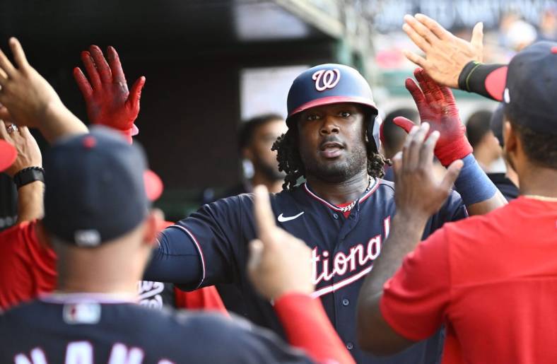 Jun 17, 2022; Washington, District of Columbia, USA; Washington Nationals first baseman Josh Bell (19) is congratulated by teammates after hitting a solo home run during the second inning against the Philadelphia Phillies at Nationals Park. Mandatory Credit: Brad Mills-USA TODAY Sports