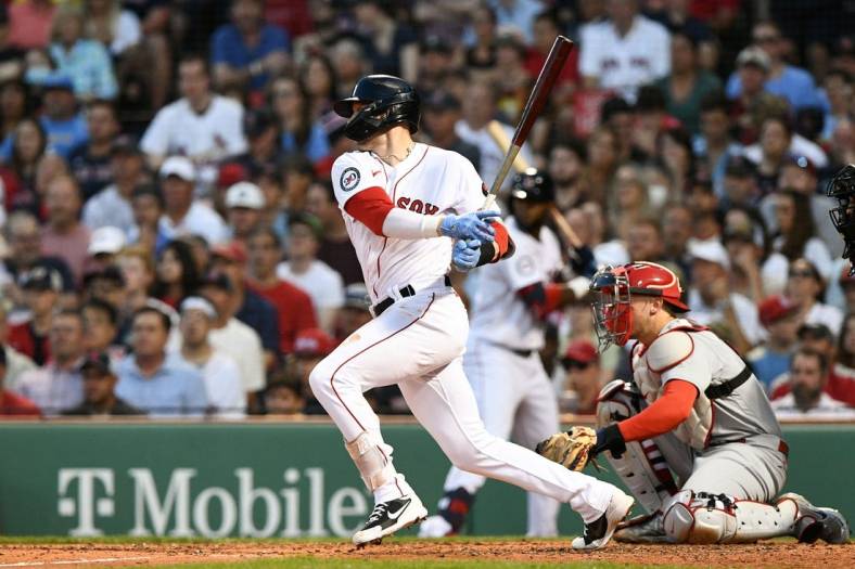 Jun 17, 2022; Boston, Massachusetts, USA; Boston Red Sox second baseman Trevor Story (10) hits a two-run RBI single against the St. Louis Cardinals during the fourth inning at Fenway Park. Mandatory Credit: Brian Fluharty-USA TODAY Sports
