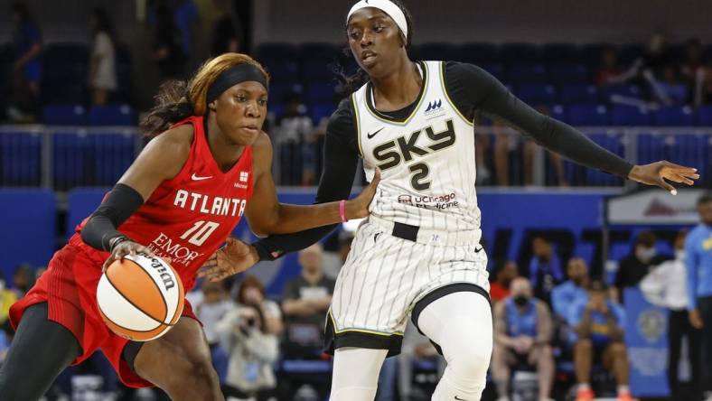 Jun 17, 2022; Chicago, Illinois, USA; Atlanta Dream guard Rhyne Howard (10) drives to the basket against Chicago Sky guard Kahleah Copper (2) during the first half of a WNBA game at Wintrust Arena. Mandatory Credit: Kamil Krzaczynski-USA TODAY Sports