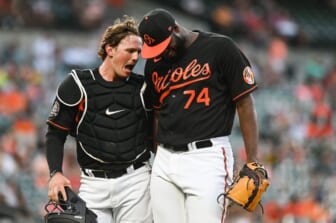 Jun 17, 2022; Baltimore, Maryland, USA;  Baltimore Orioles designated hitter Adley Rutschman (35)] celebrates with relief pitcher Felix Bautista (74) during the seventh inning against the Tampa Bay Rays at Oriole Park at Camden Yards. Mandatory Credit: Tommy Gilligan-USA TODAY Sports