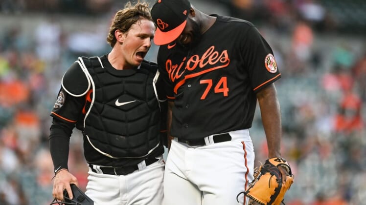 Jun 17, 2022; Baltimore, Maryland, USA;  Baltimore Orioles designated hitter Adley Rutschman (35)] celebrates with relief pitcher Felix Bautista (74) during the seventh inning against the Tampa Bay Rays at Oriole Park at Camden Yards. Mandatory Credit: Tommy Gilligan-USA TODAY Sports