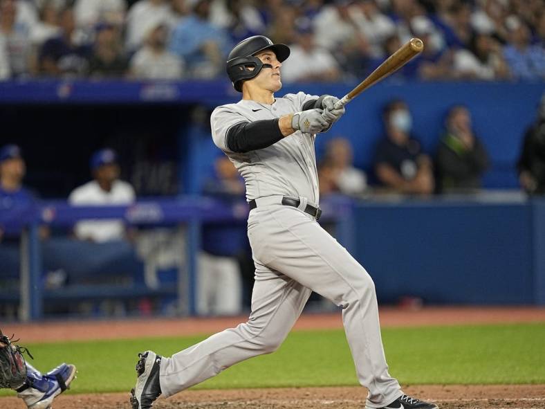 Jun 17, 2022; Toronto, Ontario, CAN; New York Yankees first baseman Anthony Rizzo (48) hits a grand slam against the Toronto Blue Jays during the fifth inning at Rogers Centre. Mandatory Credit: John E. Sokolowski-USA TODAY Sports