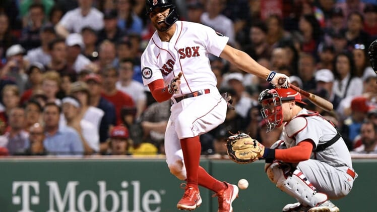Jun 17, 2022; Boston, Massachusetts, USA; Boston Red Sox shortstop Xander Bogaerts (2) reacts after fouling a ball off of his leg during the seventh inning at Fenway Park. Mandatory Credit: Brian Fluharty-USA TODAY Sports