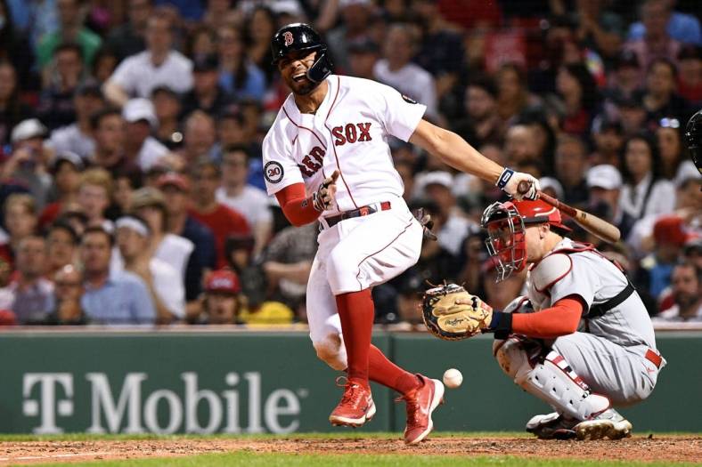 Jun 17, 2022; Boston, Massachusetts, USA; Boston Red Sox shortstop Xander Bogaerts (2) reacts after fouling a ball off of his leg during the seventh inning at Fenway Park. Mandatory Credit: Brian Fluharty-USA TODAY Sports