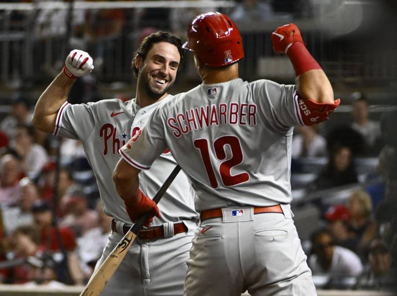 Jun 17, 2022; Washington, District of Columbia, USA; Philadelphia Phillies left fielder Matt Vierling (19) celebrates with left fielder Kyle Schwarber (12) after hitting a solo home run during the ninth inning at Nationals Park. Mandatory Credit: Brad Mills-USA TODAY Sports