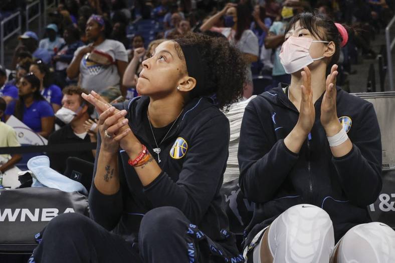 Jun 17, 2022; Chicago, Illinois, USA; Chicago Sky center Li Yueru (right) and forward Candace Parker (left) applaud their team during overtime of a WNBA game against the Atlanta Dream at Wintrust Arena. Mandatory Credit: Kamil Krzaczynski-USA TODAY Sports