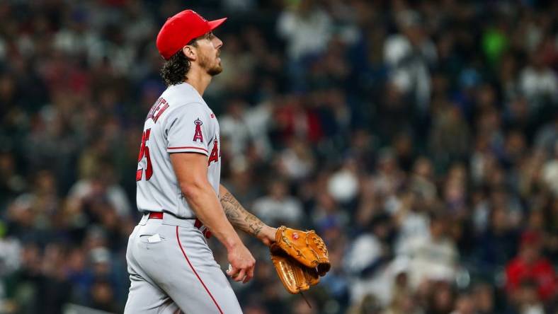 Jun 17, 2022; Seattle, Washington, USA; Los Angeles Angels starting pitcher Michael Lorenzen (25) reacts after walking in a run against the Seattle Mariners during the fourth inning at T-Mobile Park. Mandatory Credit: Lindsey Wasson-USA TODAY Sports