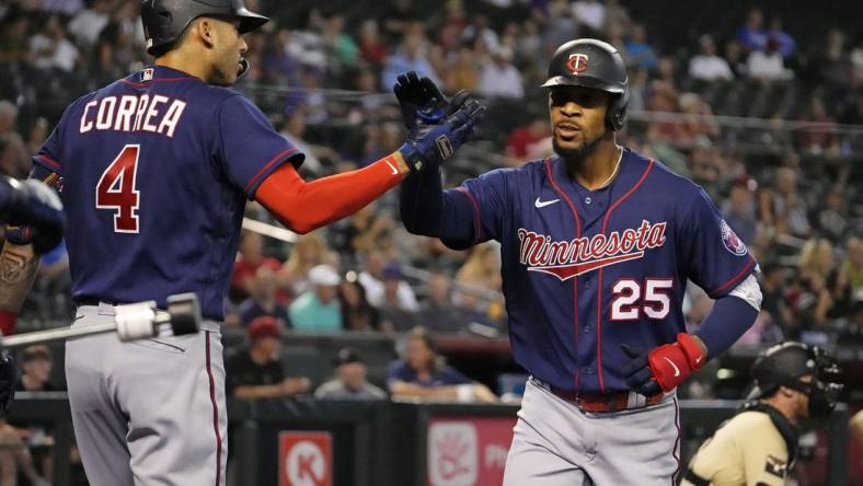 Jun 17, 2022; Phoenix, Arizona, USA; Minnesota Twins center fielder Byron Buxton (25) reacts after hitting a home run off Arizona Diamondbacks starting pitcher Madison Bumgarner in the first inning at Chase Field.

Mlb Minnesota Twins At Arizona Diamondbacks