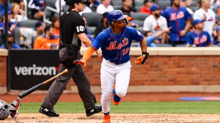 Jun 18, 2022; New York City, New York, USA; New York Mets shortstop Francisco Lindor (12) drops the bat after hitting a two-run home run against the Miami Marlins during the third inning at Citi Field. Mandatory Credit: Jessica Alcheh-USA TODAY Sports