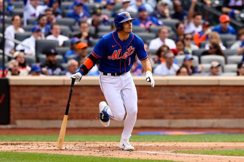 Jun 18, 2022; New York City, New York, USA; New York Mets second baseman Jeff McNeil (1) drops the bat after hitting an RBI single against the Miami Marlins during the second inning at Citi Field. Mandatory Credit: Jessica Alcheh-USA TODAY Sports