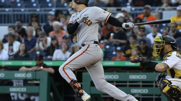 Jun 18, 2022; Pittsburgh, Pennsylvania, USA;  San Francisco Giants first baseman Wilmer Flores (41) hits a single against the Pittsburgh Pirates during the seventh inning at PNC Park. Mandatory Credit: Charles LeClaire-USA TODAY Sports