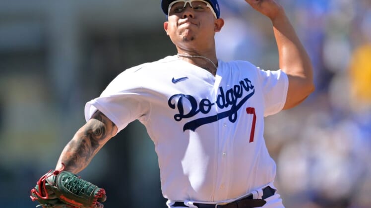 Jun 18, 2022; Los Angeles, California, USA;  Los Angeles Dodgers starting pitcher Julio Urias (7) throw against the Cleveland Guardians in the first inning at Dodger Stadium. Mandatory Credit: Jayne Kamin-Oncea-USA TODAY Sports