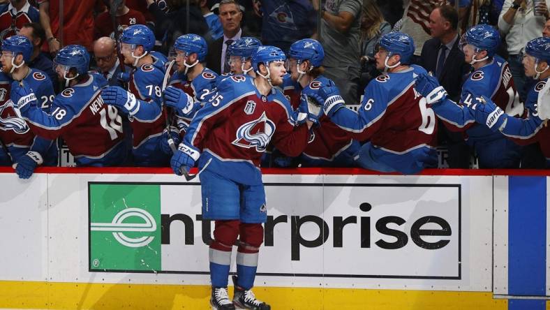 Jun 18, 2022; Denver, Colorado, USA; Colorado Avalanche left wing Andre Burakovsky (95) is congratulated following his goal against the Tampa Bay Lightning during the first period in game two of the 2022 Stanley Cup Final at Ball Arena. Mandatory Credit: Isaiah J. Downing-USA TODAY Sports