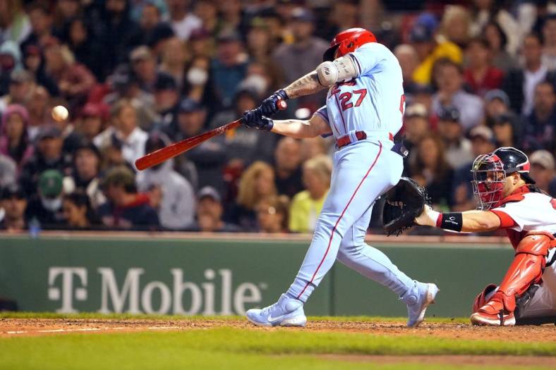 Jun 18, 2022; Boston, Massachusetts, USA; St. Louis Cardinals left fielder Tyler O'Neill (27) hits a home run against the Boston Red Sox during the sixth inning at Fenway Park. Mandatory Credit: Gregory Fisher-USA TODAY Sports