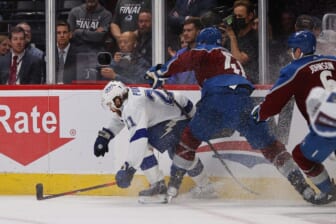Jun 18, 2022; Denver, Colorado, USA; Colorado Avalanche defenseman Josh Manson (42) hits Tampa Bay Lightning center Brayden Point (21) during the third period in game two of the 2022 Stanley Cup Final at Ball Arena. Mandatory Credit: Isaiah J. Downing-USA TODAY Sports