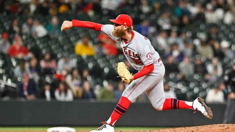 Jun 18, 2022; Seattle, Washington, USA; Los Angeles Angels relief pitcher Archie Bradley (23) throws against the Seattle Mariners during the ninth inning at T-Mobile Park. Los Angeles won 3-0. Mandatory Credit: Steven Bisig-USA TODAY Sports