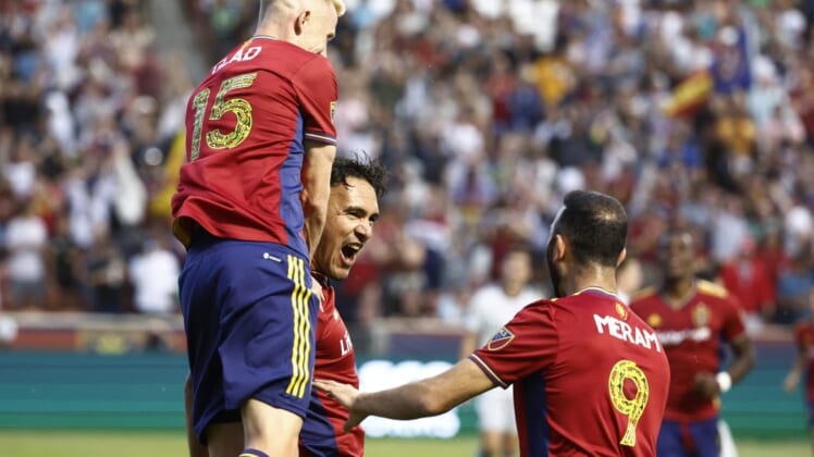 Jun 18, 2022; Sandy, Utah, USA; Real Salt Lake defender Marcelo Silva (30) is congratulated by defender Justen Glad (15) and forward Justin Meram (9) celebrates after his first half goal against the San Jose Earthquakes at Rio Tinto Stadium. Mandatory Credit: Jeffrey Swinger-USA TODAY Sports