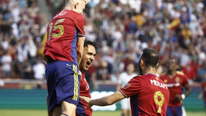 Jun 18, 2022; Sandy, Utah, USA; Real Salt Lake defender Marcelo Silva (30) is congratulated by defender Justen Glad (15) and forward Justin Meram (9) celebrates after his first half goal against the San Jose Earthquakes at Rio Tinto Stadium. Mandatory Credit: Jeffrey Swinger-USA TODAY Sports