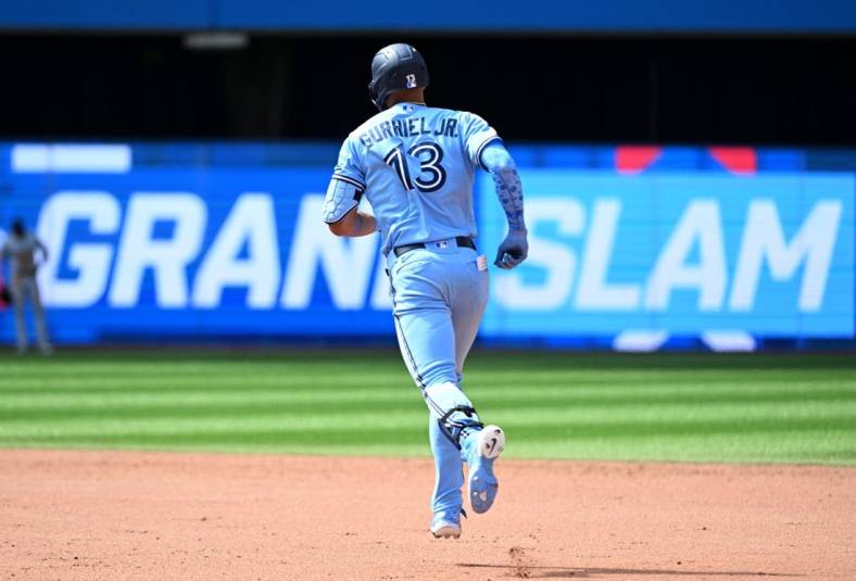 Jun 19, 2022; Toronto, Ontario, CAN; Toronto Blue Jays left fielder Lourdes Gurriel Jr. (13) runs the bases after hitting a grand slam home run against the New York Yankees in the sixth inning at Rogers Centre. Mandatory Credit: Dan Hamilton-USA TODAY Sports