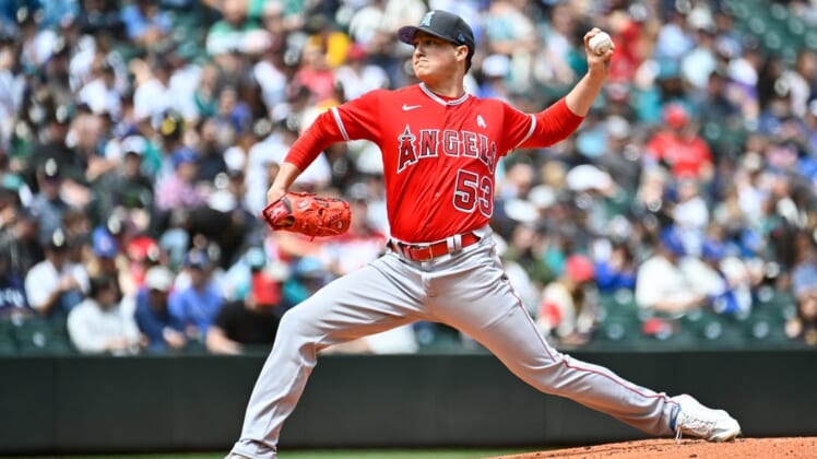 Jun 19, 2022; Seattle, Washington, USA; Los Angeles Angels starting pitcher Kenny Rosenberg (53) pitches to the Seattle Mariners during the first inning at T-Mobile Park. Mandatory Credit: Steven Bisig-USA TODAY Sports