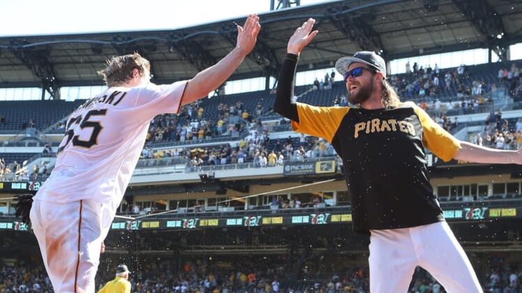 Jun 19, 2022; Pittsburgh, Pennsylvania, USA; Pittsburgh Pirates right fielder Jack Suwinski (65) high fives pitcher JT Brubaker (right) after Suwinski hit three solo home runs including a walk off game winner in the ninth inning against the San Francisco Giants at PNC Park. The Pirates won 4-3. Mandatory Credit: Charles LeClaire-USA TODAY Sports