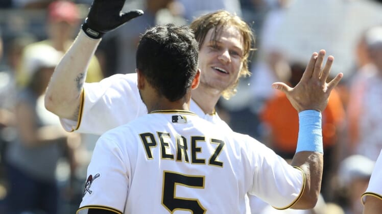 Jun 19, 2022; Pittsburgh, Pennsylvania, USA; Pittsburgh Pirates right fielder Jack Suwinski (rear) celebrates with catcher Michael Perez (5) after Suwinski hit his third solo home run which was a walk off game winner in the ninth inning against the San Francisco Giants at PNC Park. The Pirates won 4-3. Mandatory Credit: Charles LeClaire-USA TODAY Sports
