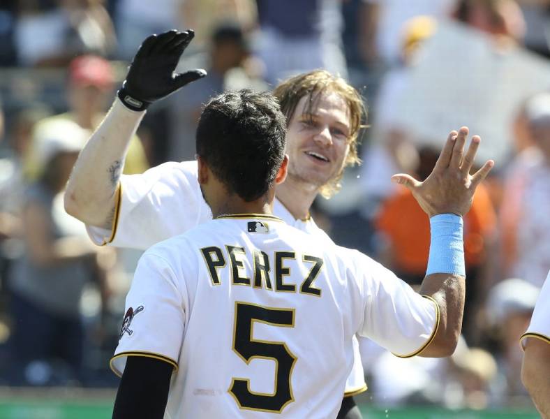 Jun 19, 2022; Pittsburgh, Pennsylvania, USA; Pittsburgh Pirates right fielder Jack Suwinski (rear) celebrates with catcher Michael Perez (5) after Suwinski hit his third solo home run which was a walk off game winner in the ninth inning against the San Francisco Giants at PNC Park. The Pirates won 4-3. Mandatory Credit: Charles LeClaire-USA TODAY Sports