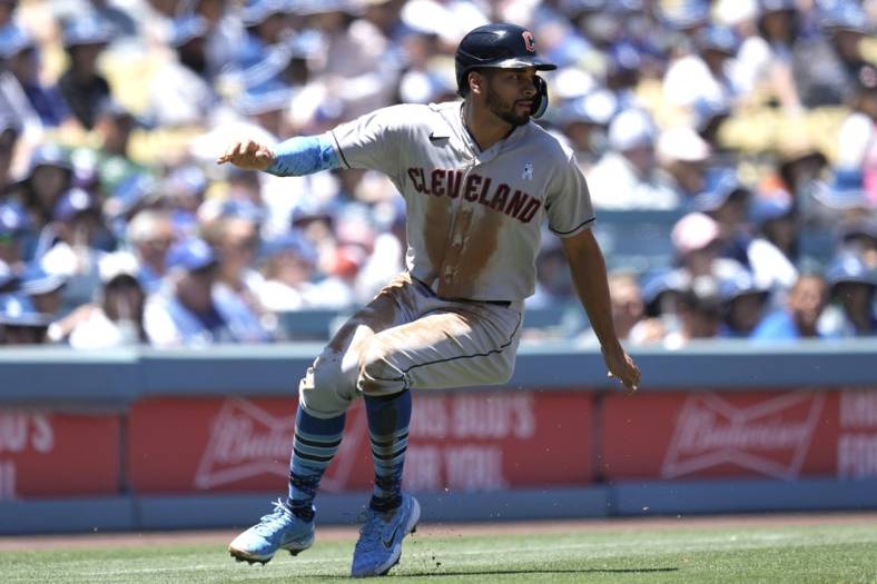 Jun 19, 2022; Los Angeles, California, USA; Cleveland Guardians left fielder Oscar Mercado (35) rounds third base to score in the second inning against the Los Angeles Dodgers at Dodger Stadium. Mandatory Credit: Kirby Lee-USA TODAY Sports