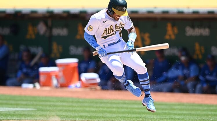 Jun 19, 2022; Oakland, California, USA; Oakland Athletics second baseman Tony Kemp (5) is hit by a pitch thrown by Kansas City Royals starting pitcher Brady Singer (51) during the third inning at RingCentral Coliseum. Mandatory Credit: Robert Edwards-USA TODAY Sports