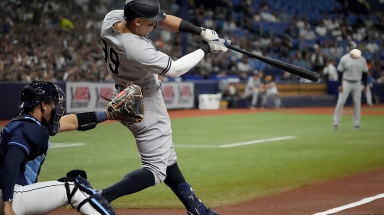 Jun 20, 2022; St. Petersburg, Florida, USA;  New York Yankees right fielder Aaron Judge (99) hits a home run in the first inning against the Tampa Bay Rays at Tropicana Field. Mandatory Credit: Dave Nelson-USA TODAY Sports