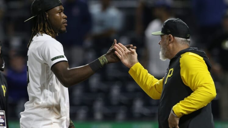 Jun 20, 2022; Pittsburgh, Pennsylvania, USA;  Pittsburgh Pirates shortstop Oneil Cruz (15) and manager Derek Shelton (right) celebrate after defeating the Chicago Cubs at PNC Park. The Pirates won 12-1. Mandatory Credit: Charles LeClaire-USA TODAY Sports