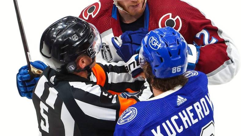 Jun 20, 2022; Tampa, Florida, USA; Colorado Avalanche defenseman Josh Manson (42) and Tampa Bay Lightning right wing Nikita Kucherov (86) exchange words during the second period in game three of the 2022 Stanley Cup Final at Amalie Arena. Mandatory Credit: Mark J. Rebilas-USA TODAY Sports